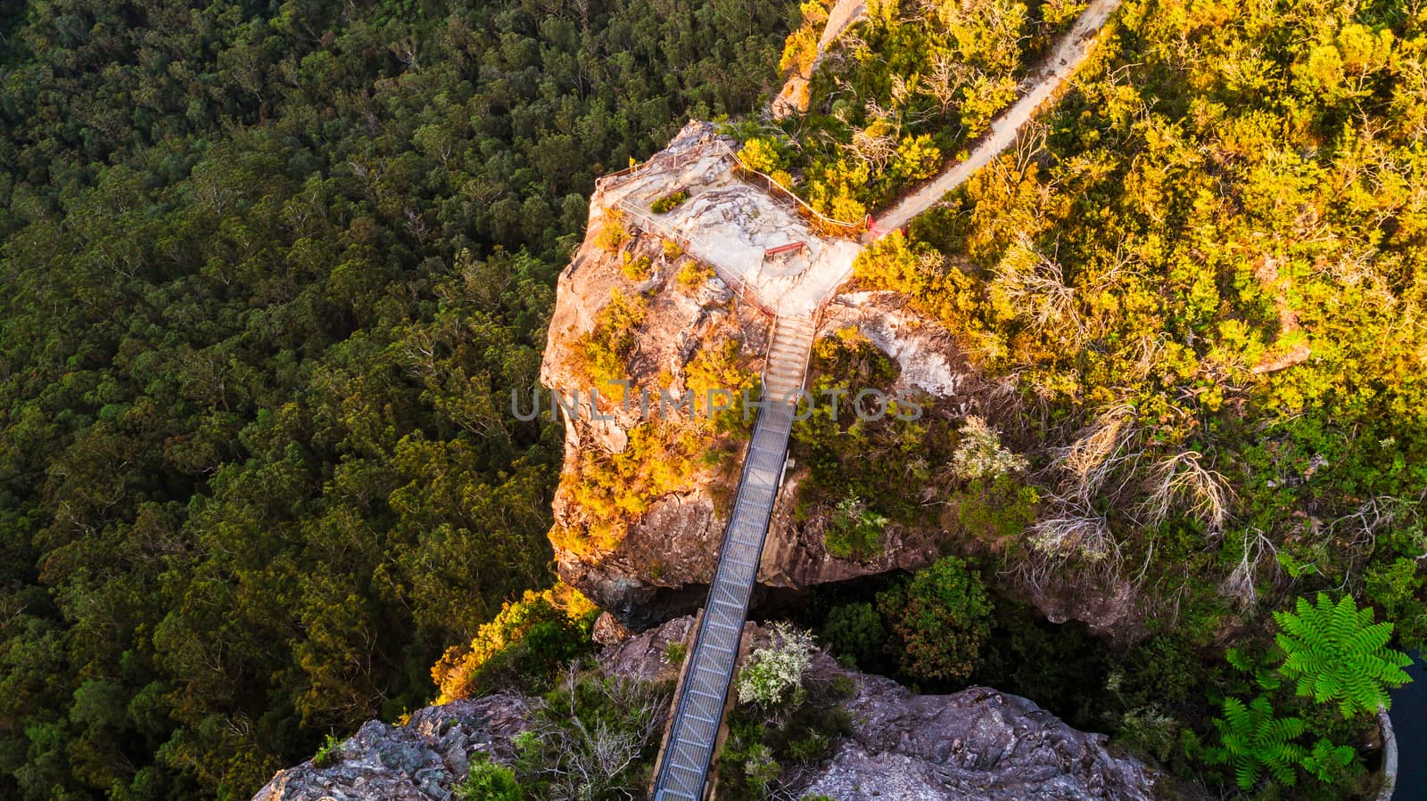 14m steel bridge across the deep rock chasm on the edge of the sandstone escarpment cliff faces.   It  connects to scenic lookout with spectacular over Blue Mountains and Jamison Valley