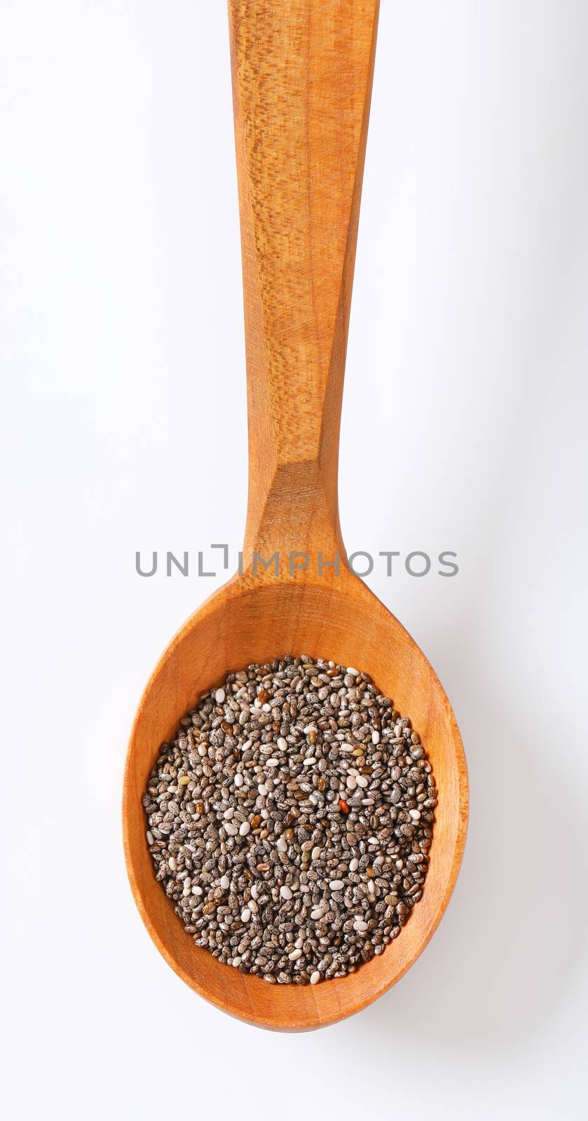spoon of healthy chia seeds on white background