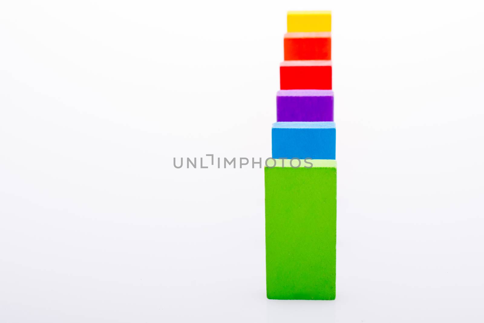 Colorful Domino Blocks in a line on a white background