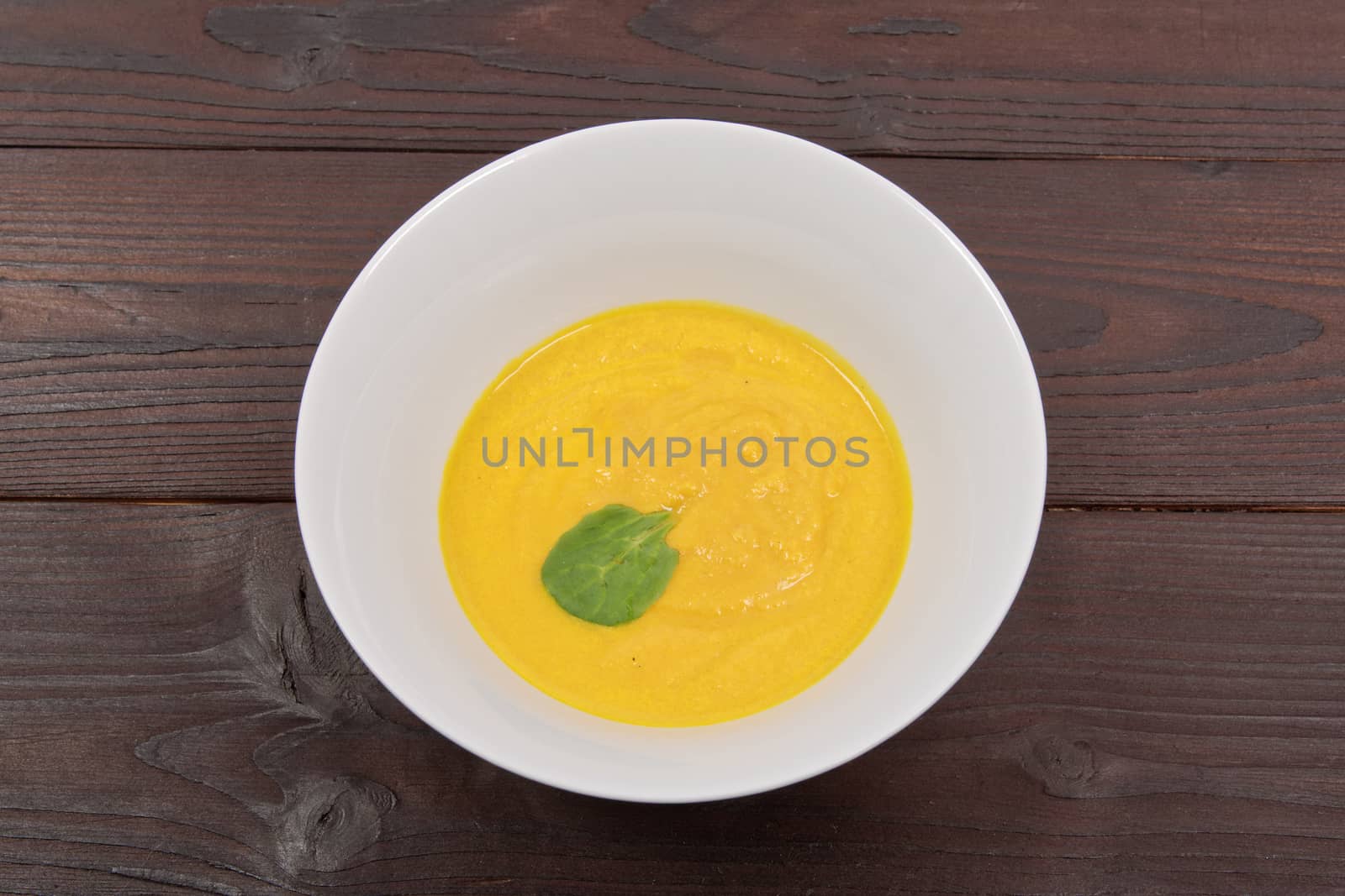 Miso vegetable soup with vegetables on a wooden table