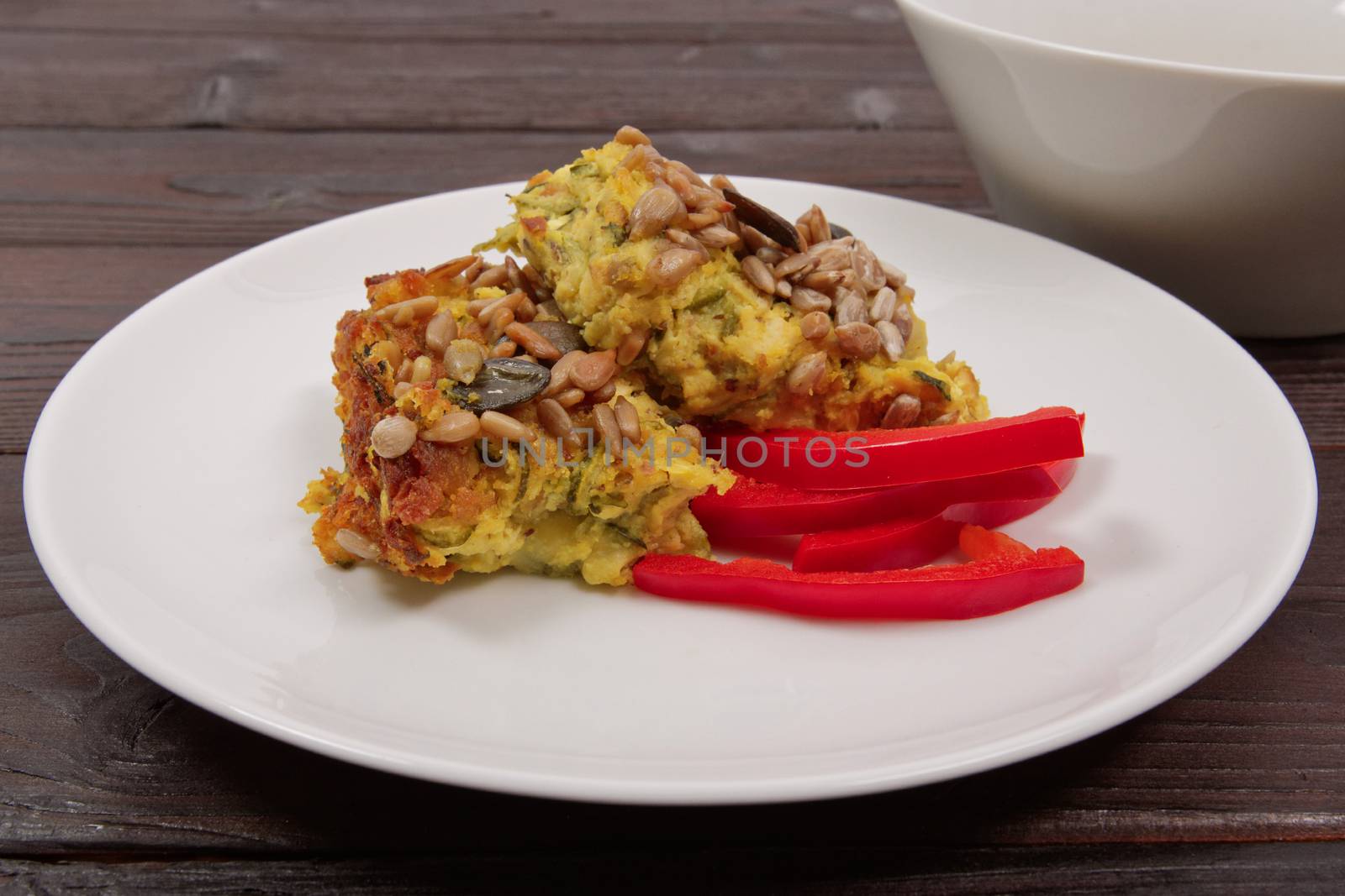 Azuki with vegetables on steam on a wooden table