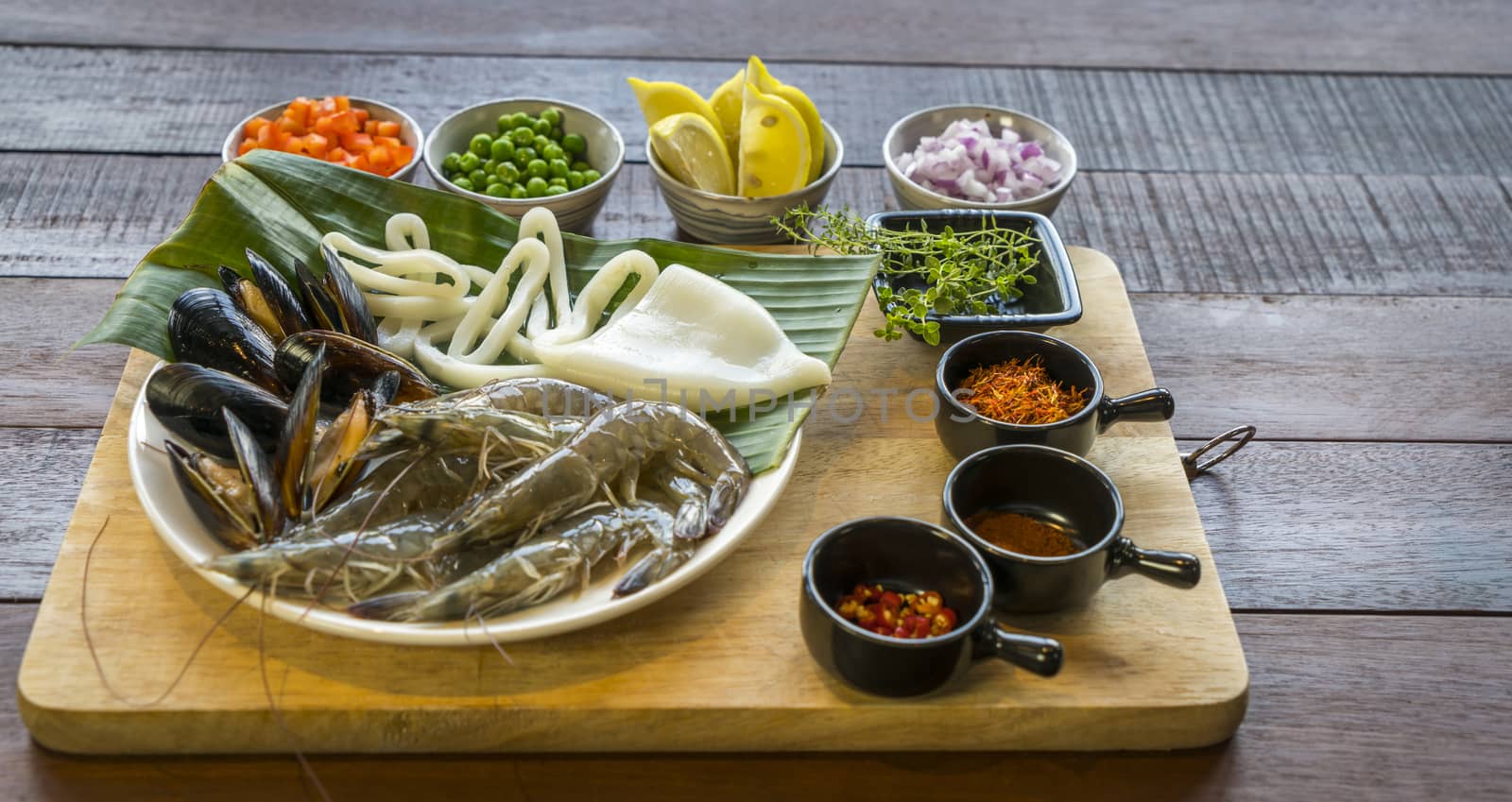Raw seafood on plate, healthy food, prawn, clam squid.