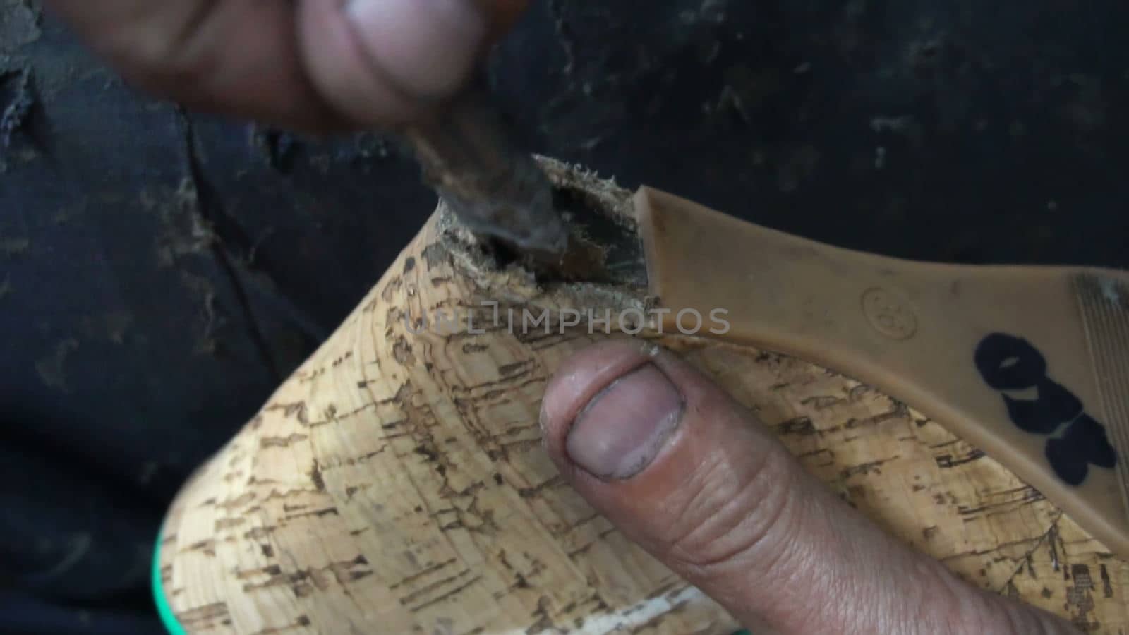 the shoemaker at work.The process of repairing shoes in workshop.