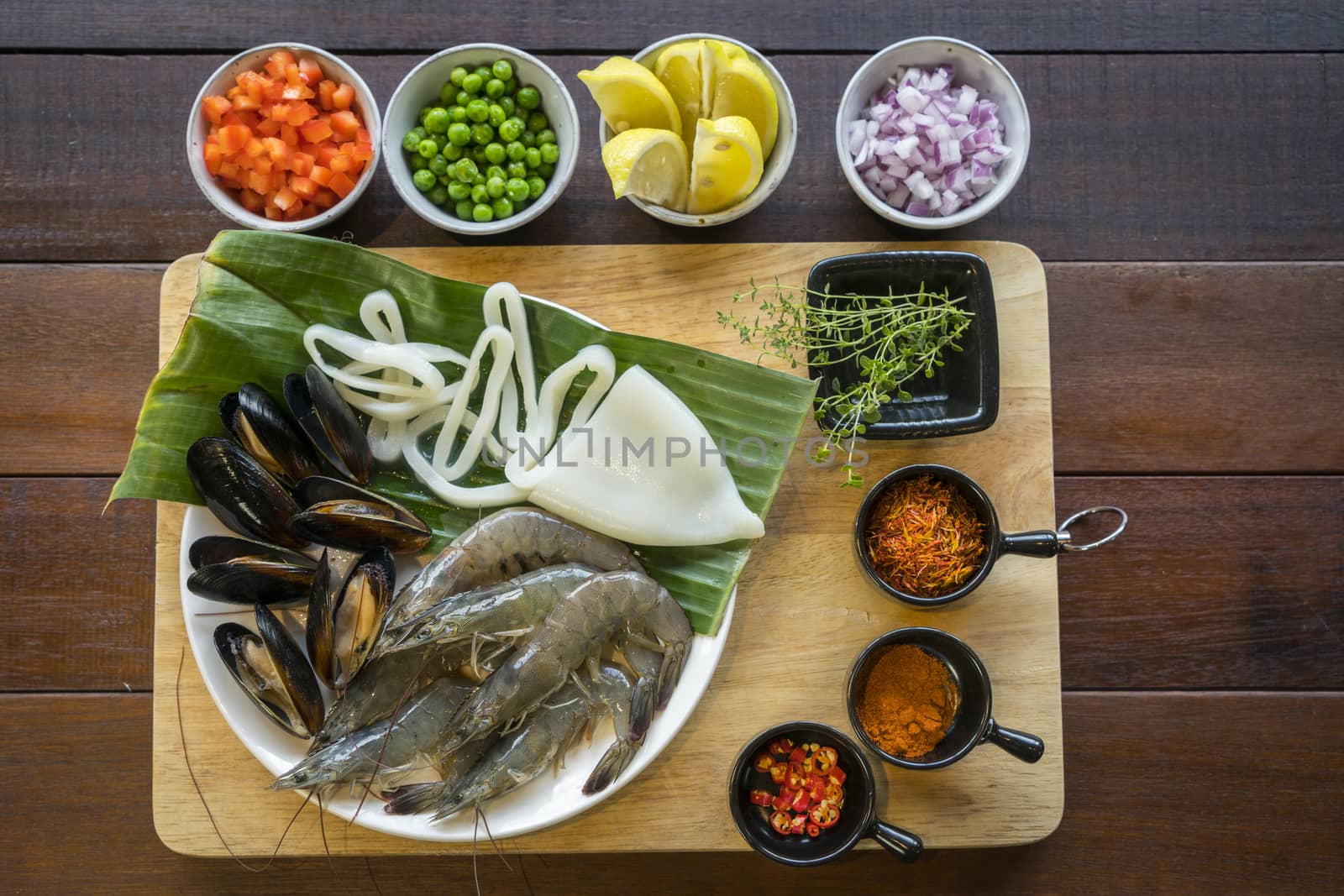 Raw seafood on plate, healthy food, prawn, clam squid.
