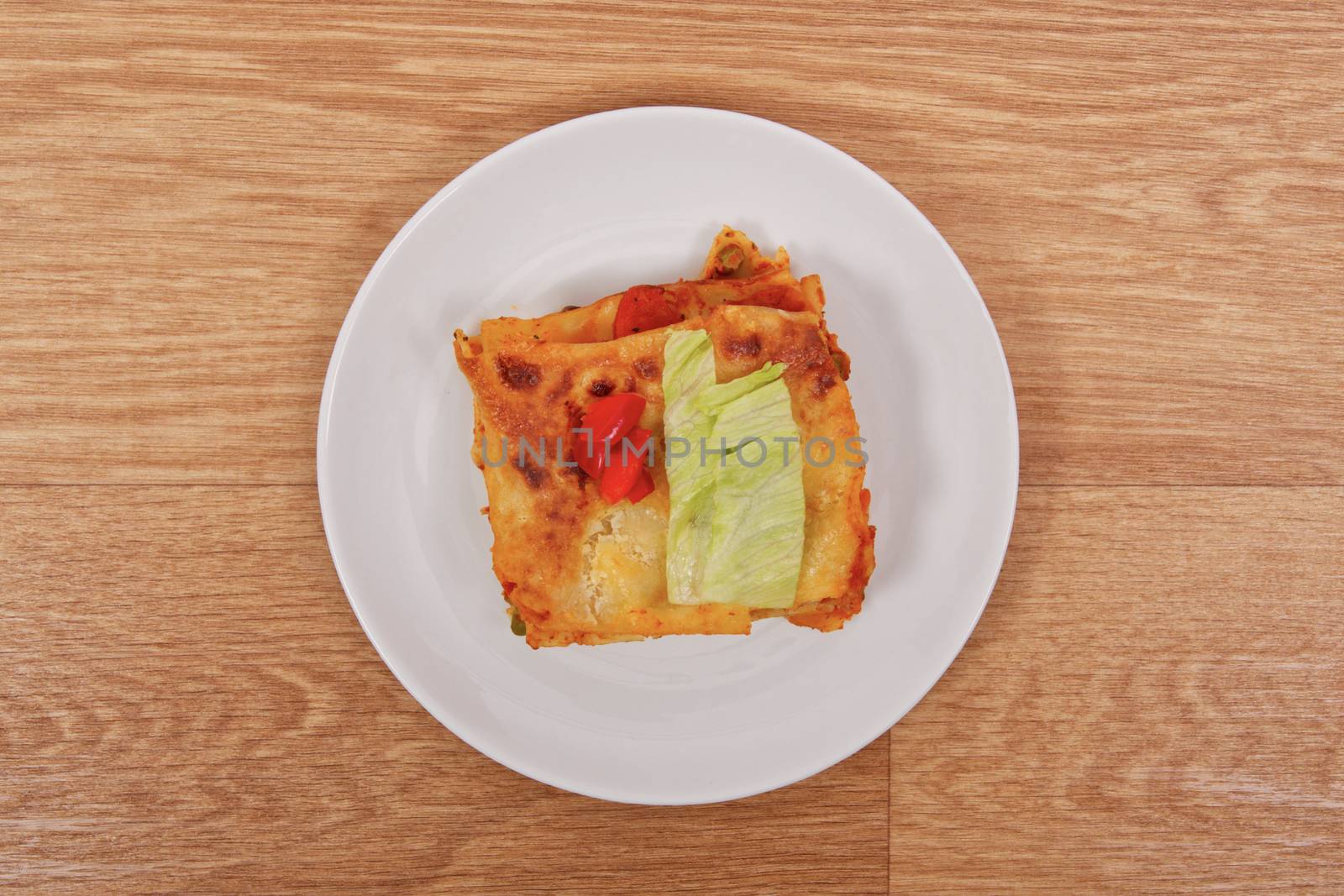 Lasagna with vegetables on a table by neryx