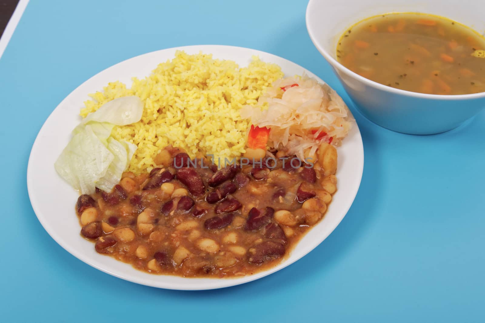 Red beans with curry rice on a blue background