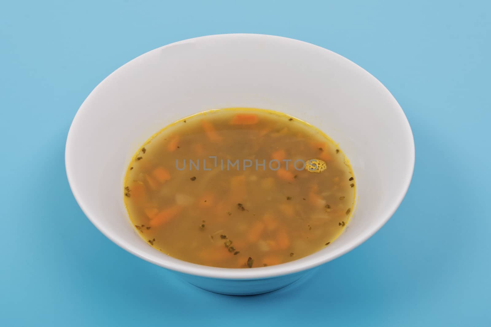 Lentil soup with carrots on a blue by neryx