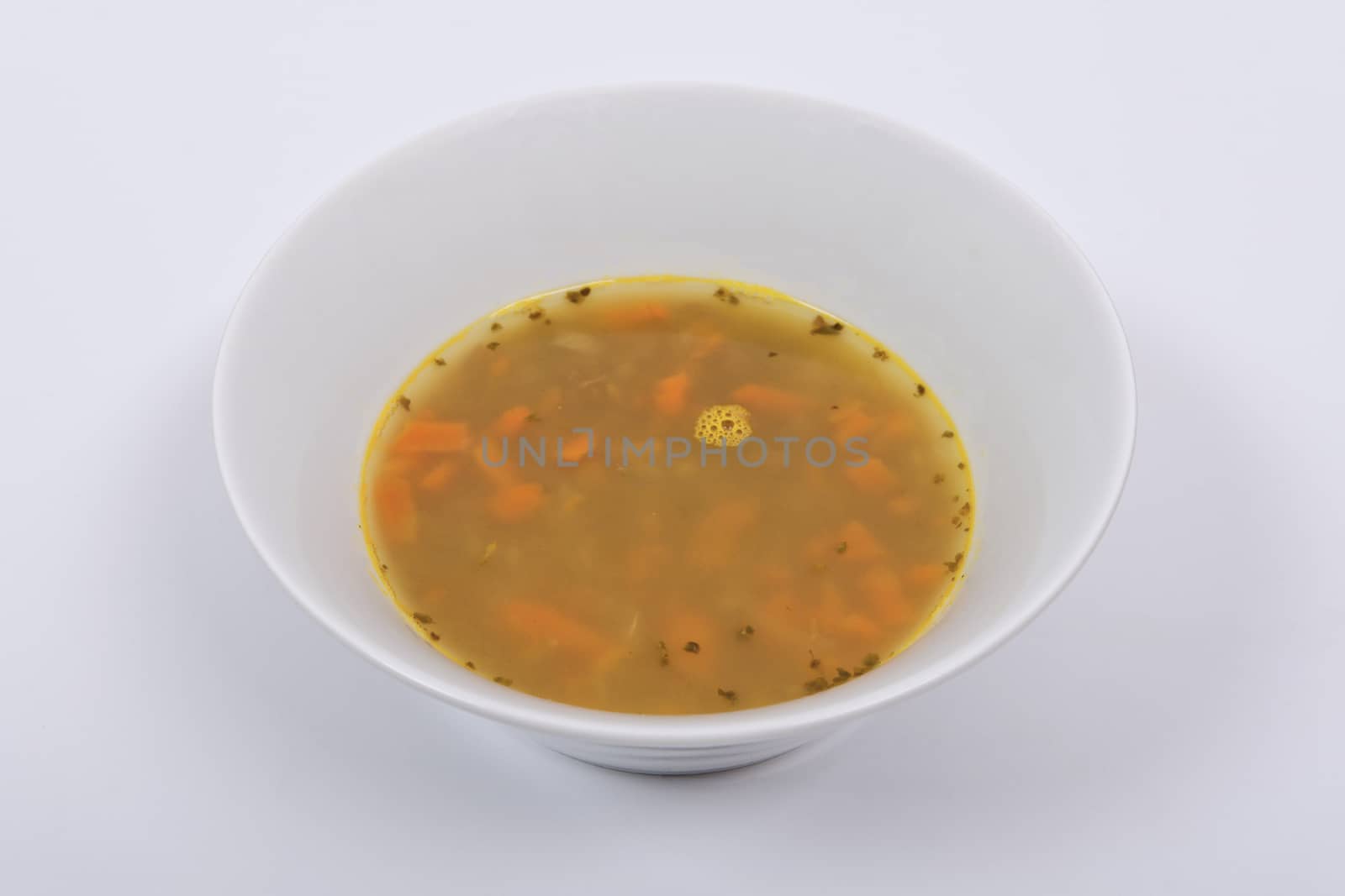 Lentil soup with carrots on a white background