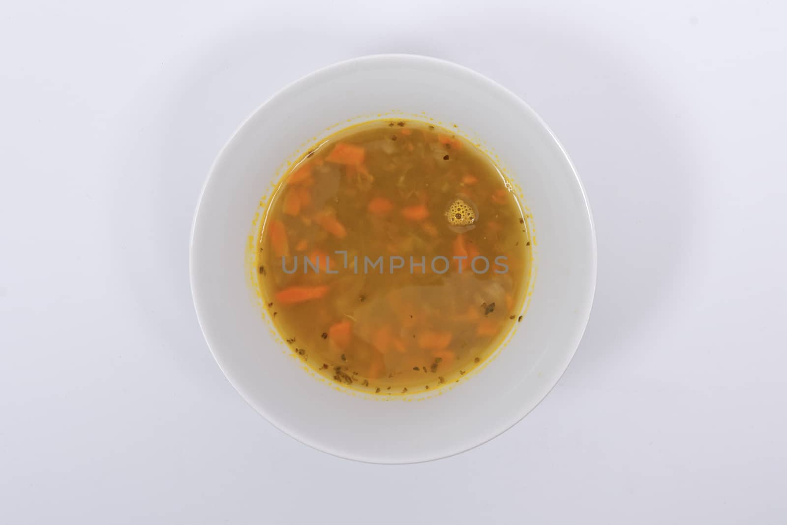 Lentil soup with carrots on a white by neryx
