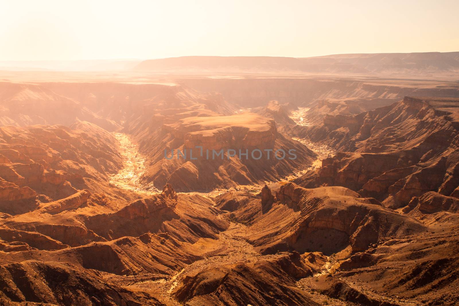Horseshoe bend in Fish River Canyon on hot sunny day, Namibia.