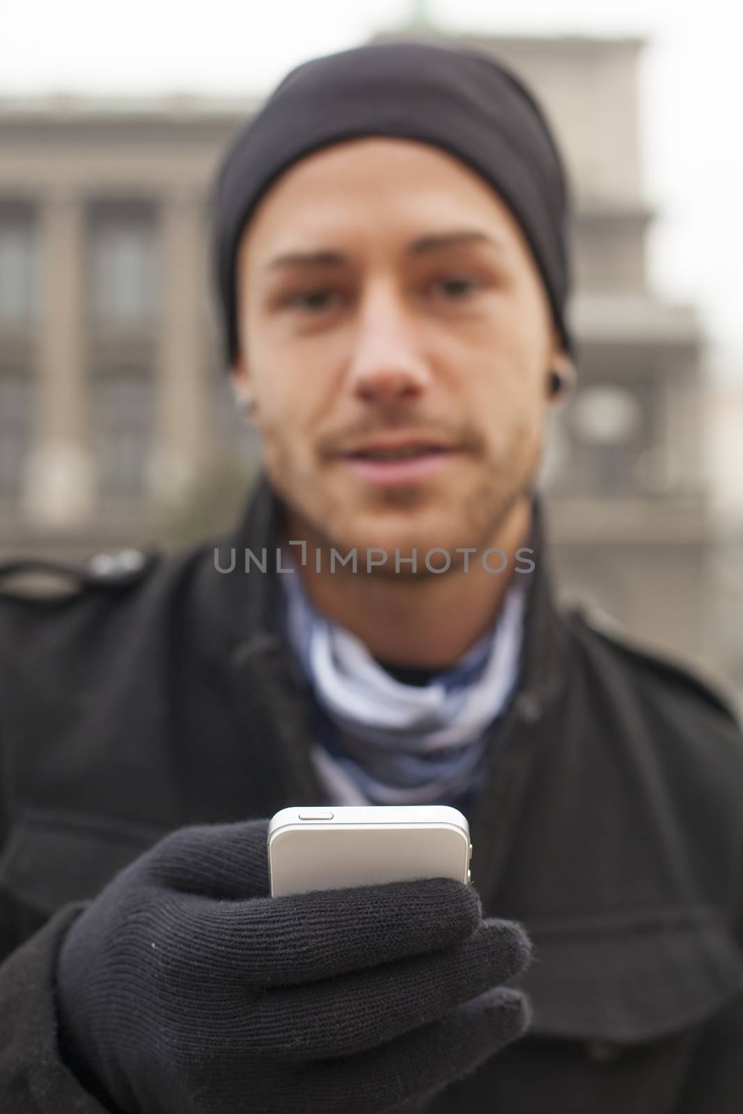 Traveling Man With Mobile Phone And Hat, In City, Urban Space