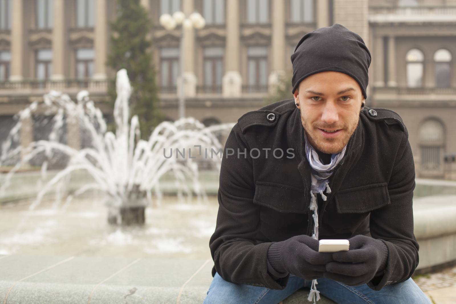 Young Man With Mobile Phone Outdoor
