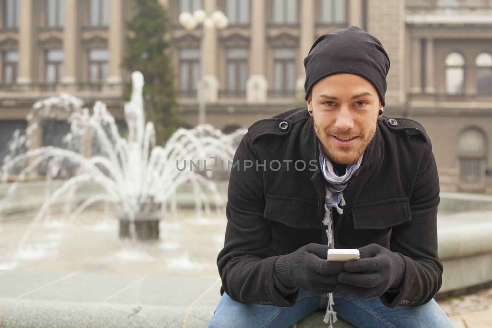 Young Man With Mobile Phone Outdoor