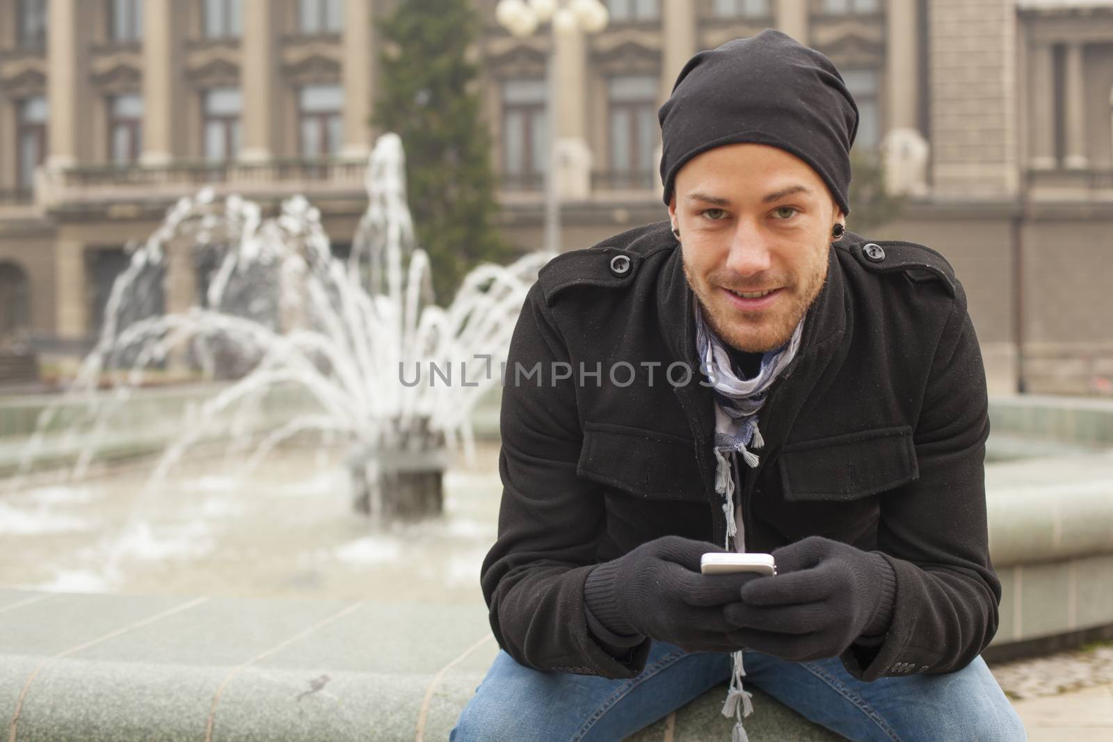 Guy On Traveling With Mobile Phone And Hat In City, Urban Space by adamr