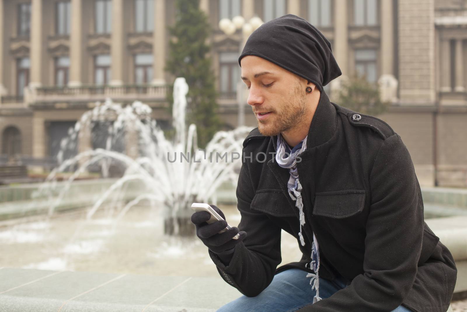 Traveling Man With Mobile Phone And Hat In City, Urban Space