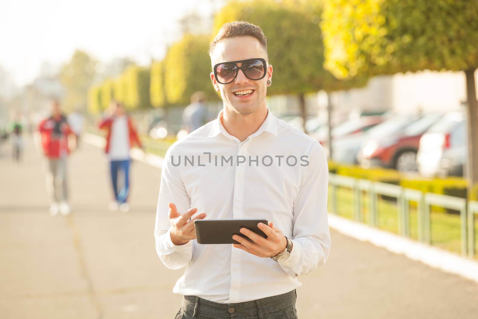 Man with mobile phone in hands by adamr