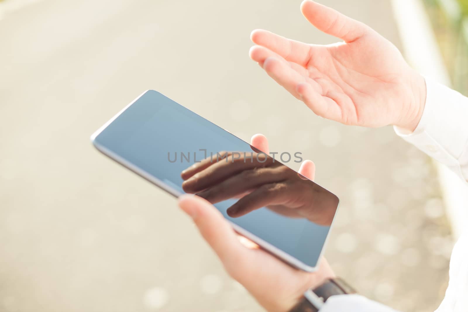 Close up of man hands using touchscreen on digital tablet