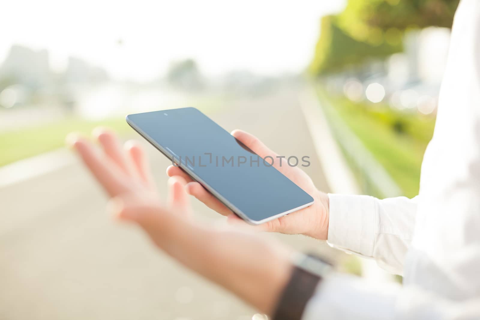 Close up of man hands using touchscreen on digital tablet