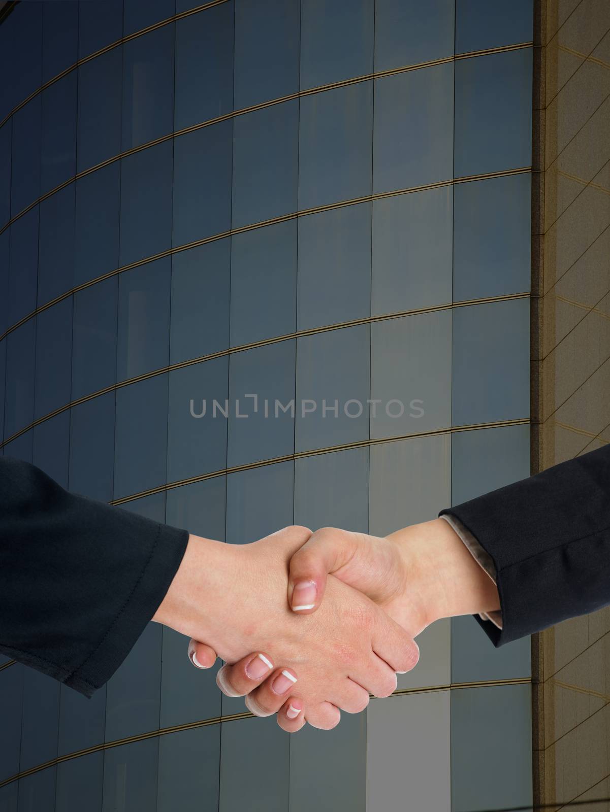 Architectural Handshaking in front of building by adamr