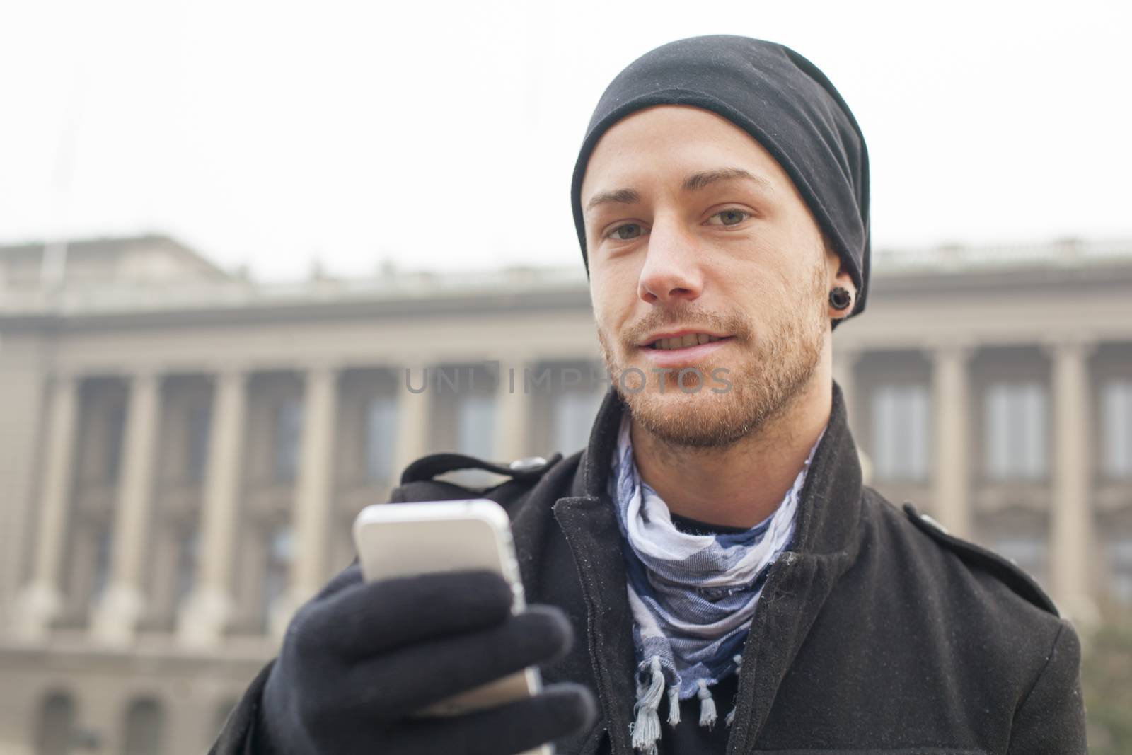 Traveling Man With Mobile Phone And Hat, In City, Urban Space