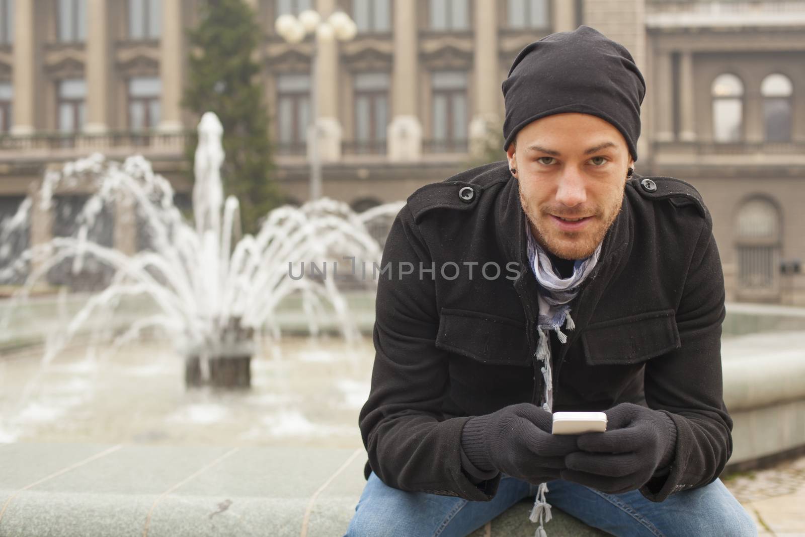 Traveling Man With Mobile Phone And Hat In City, Urban Space by adamr