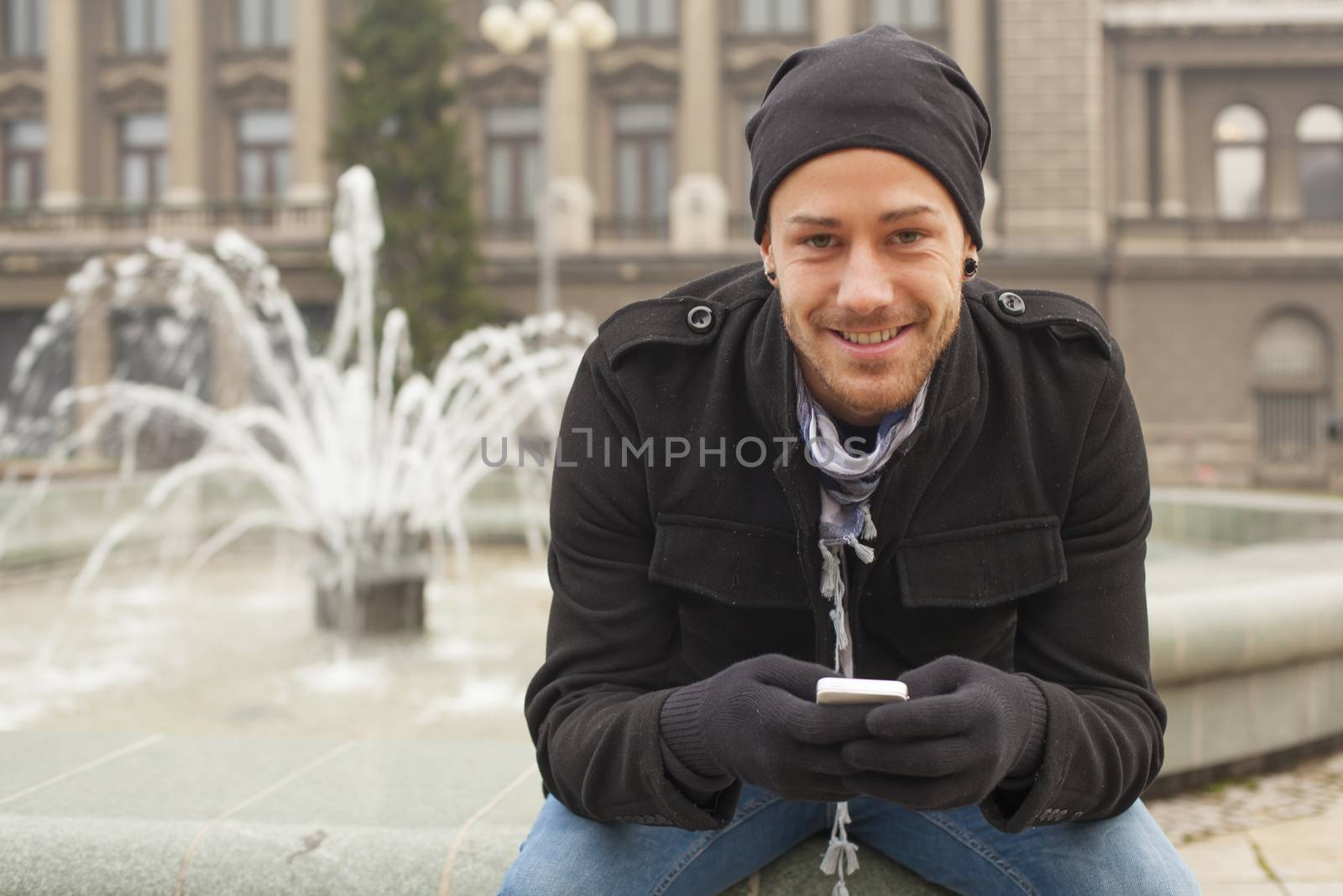 Traveling Man With Mobile Phone And Hat In City, Urban Space