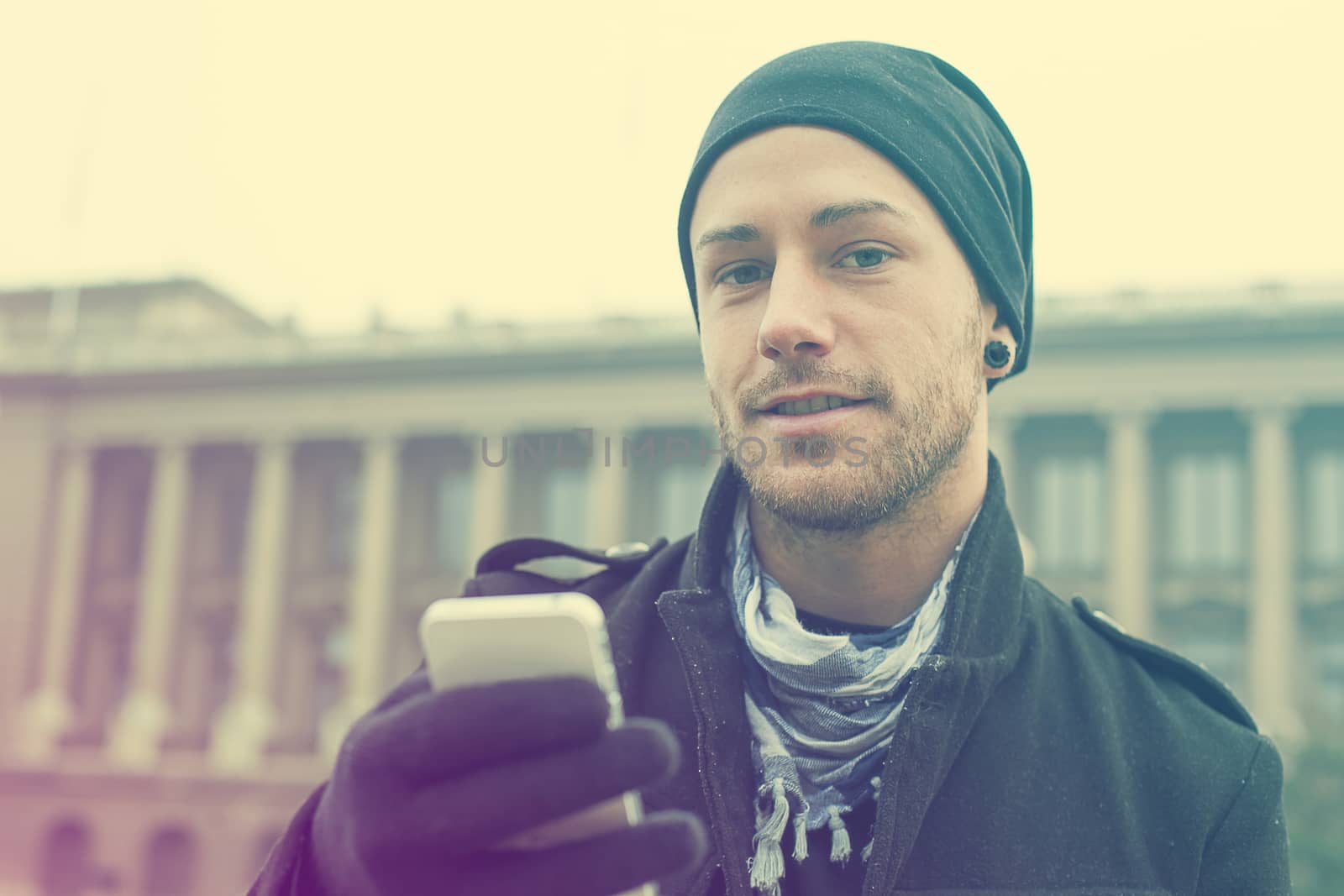 Traveling Man With Mobile Phone And Hat, In City, Urban Space