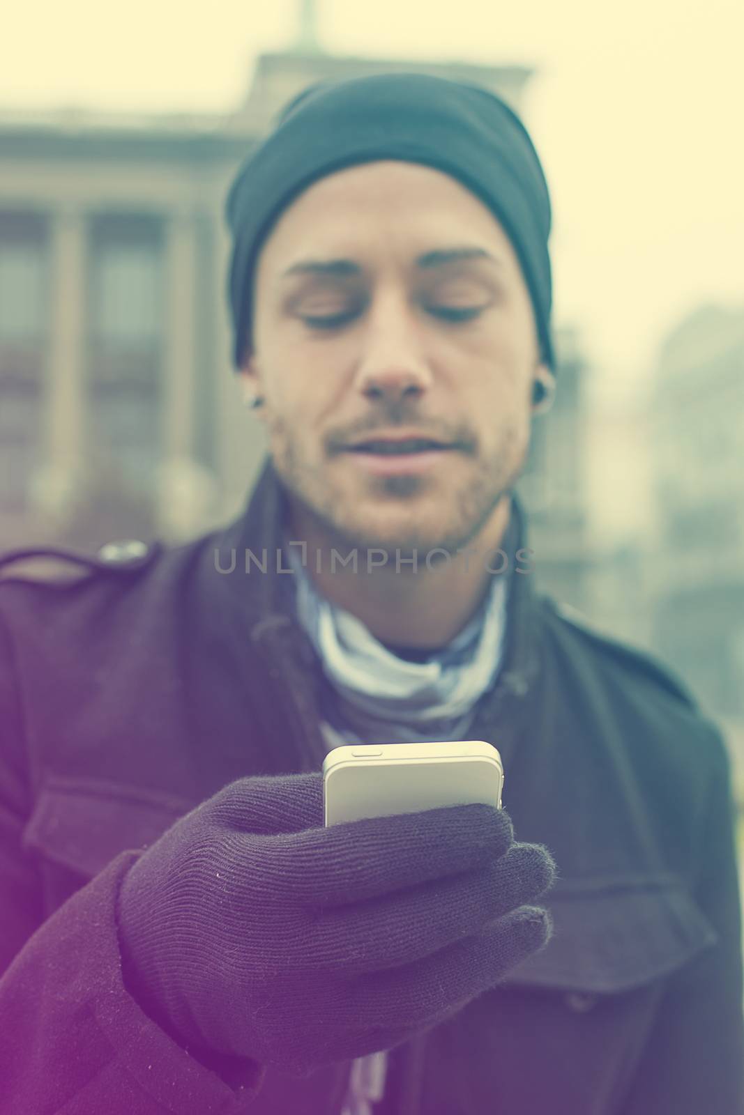 Man with mobile phone in hands by adamr