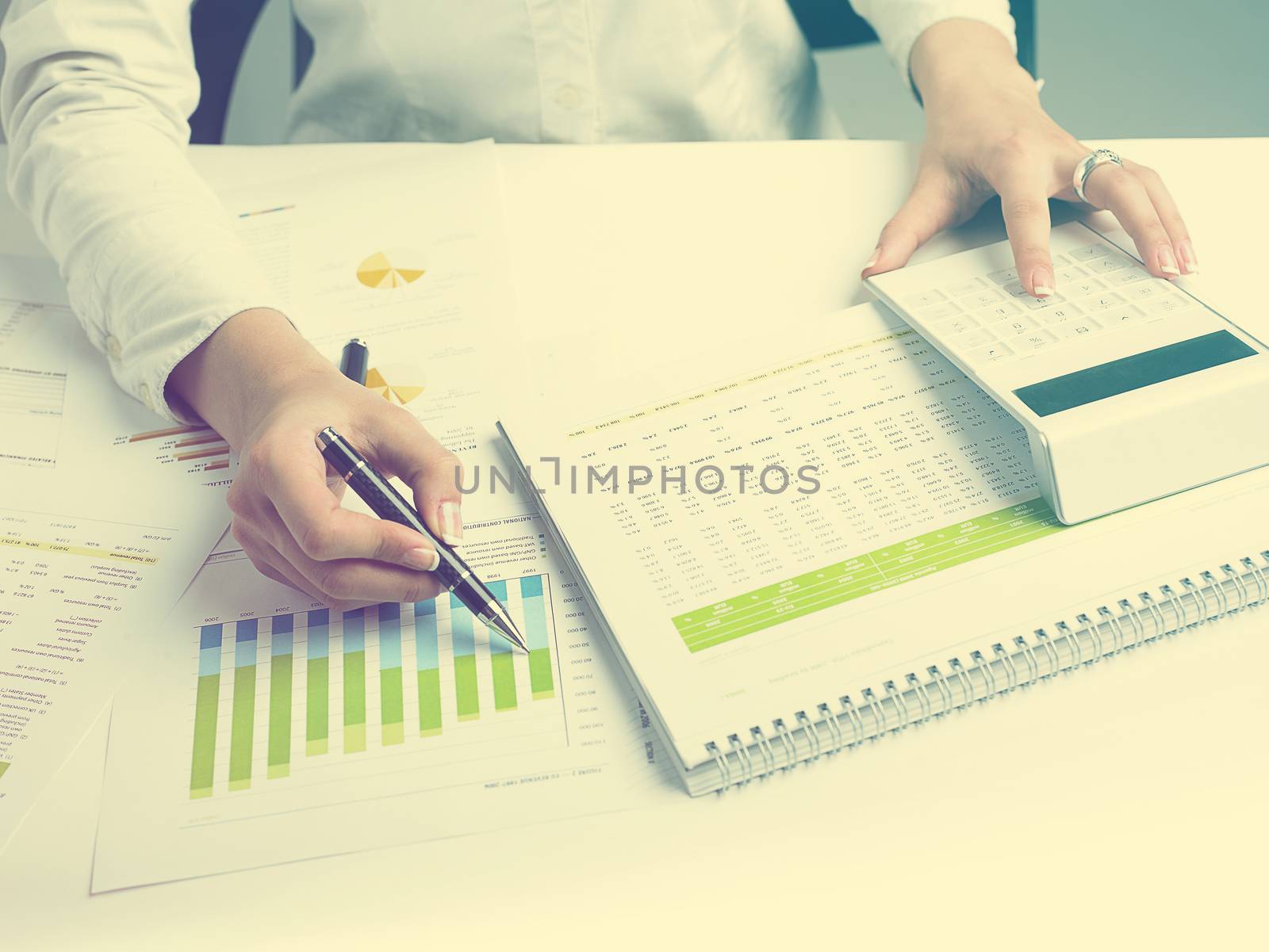 Market Analyze - pen and calculator on papers