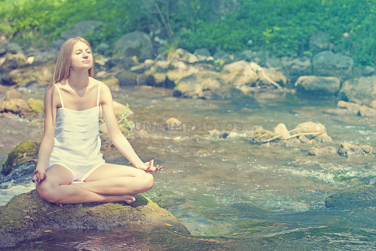 Beautiful Woman Practive Yoga On River In Nature by adamr