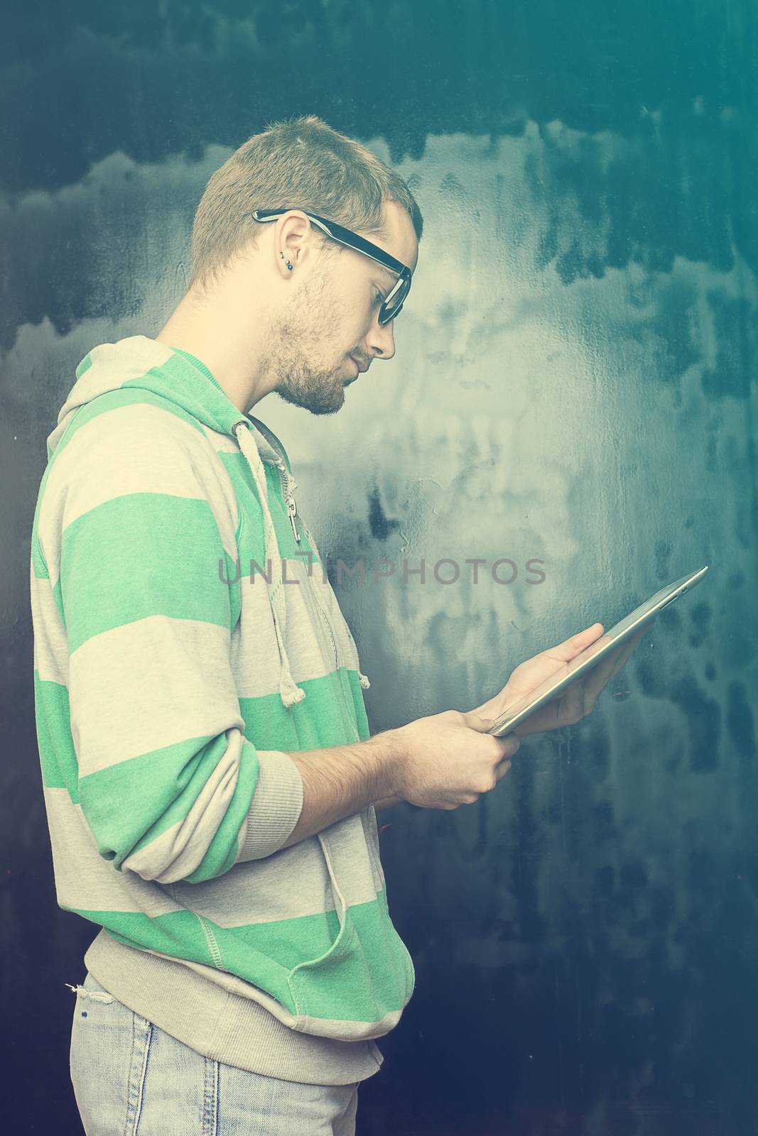 Young Man With Tablet Computer by adamr