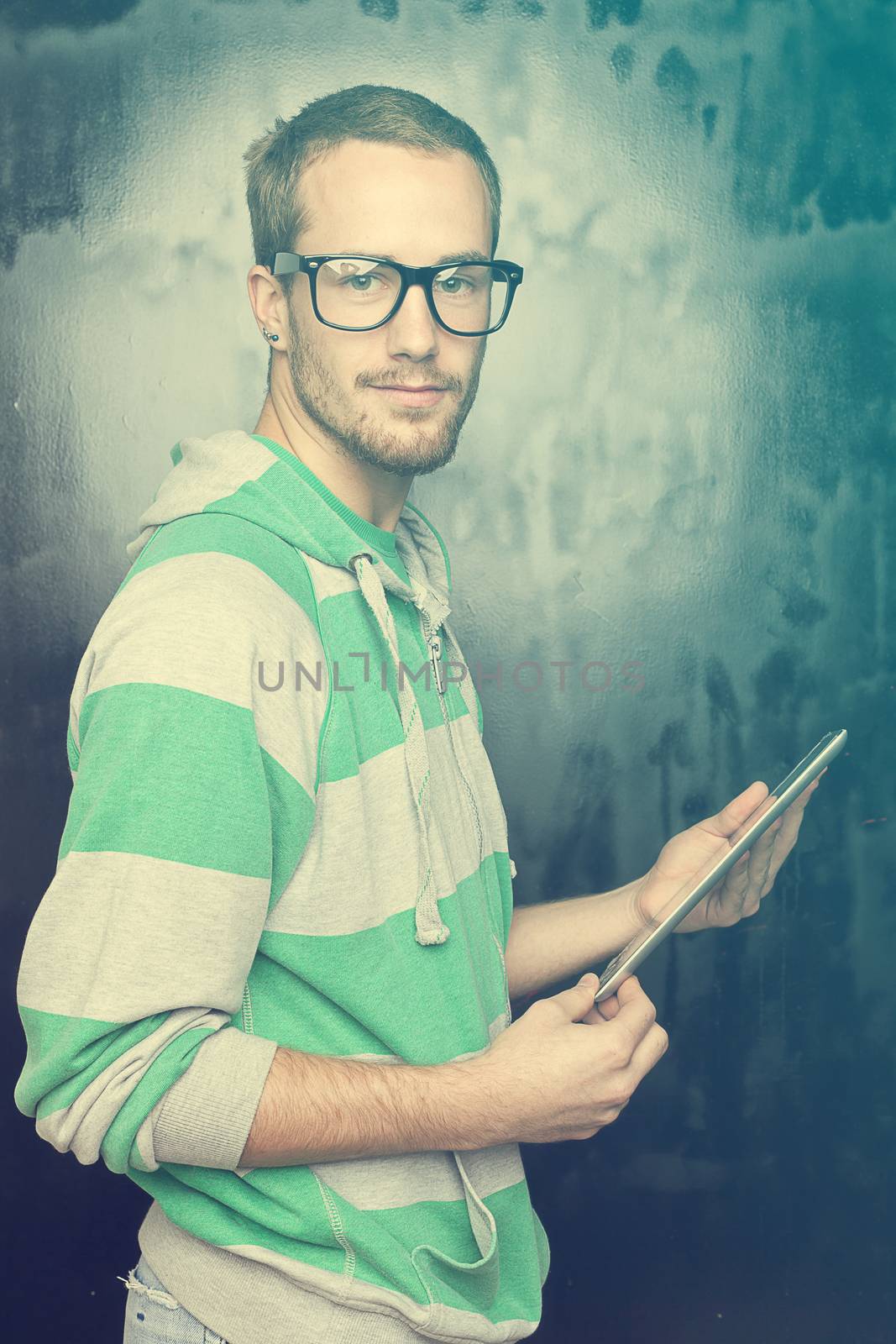 Good Looking Young Nerd Smart Guy Man Using Tablet Computer