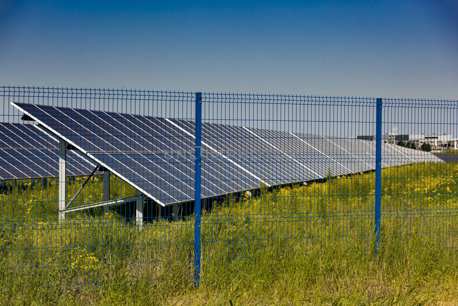 Grin clean electric power - Solar panel outside on grass photovoltaic