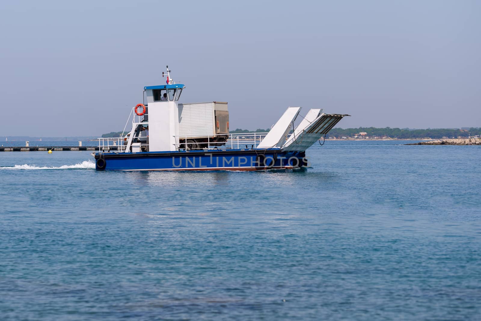 Small local ferry for one car or small truck connecting nearby islands with the mainland