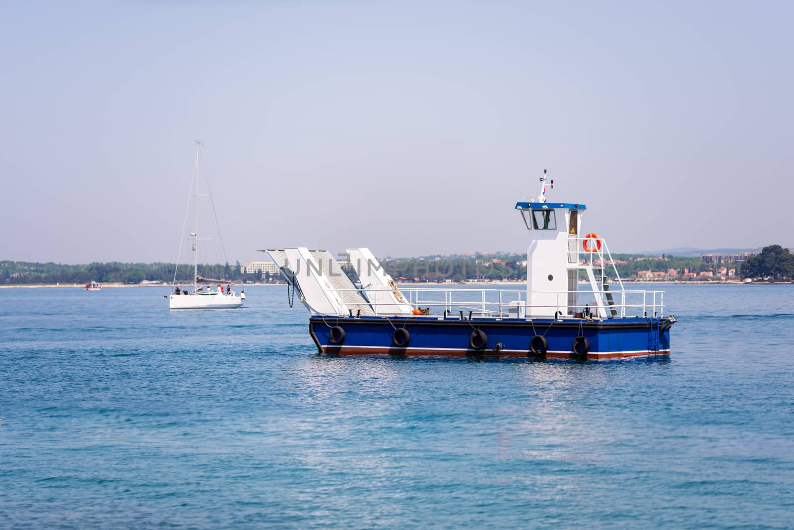 Small local ferry for one car or small truck connecting nearby islands with the mainland