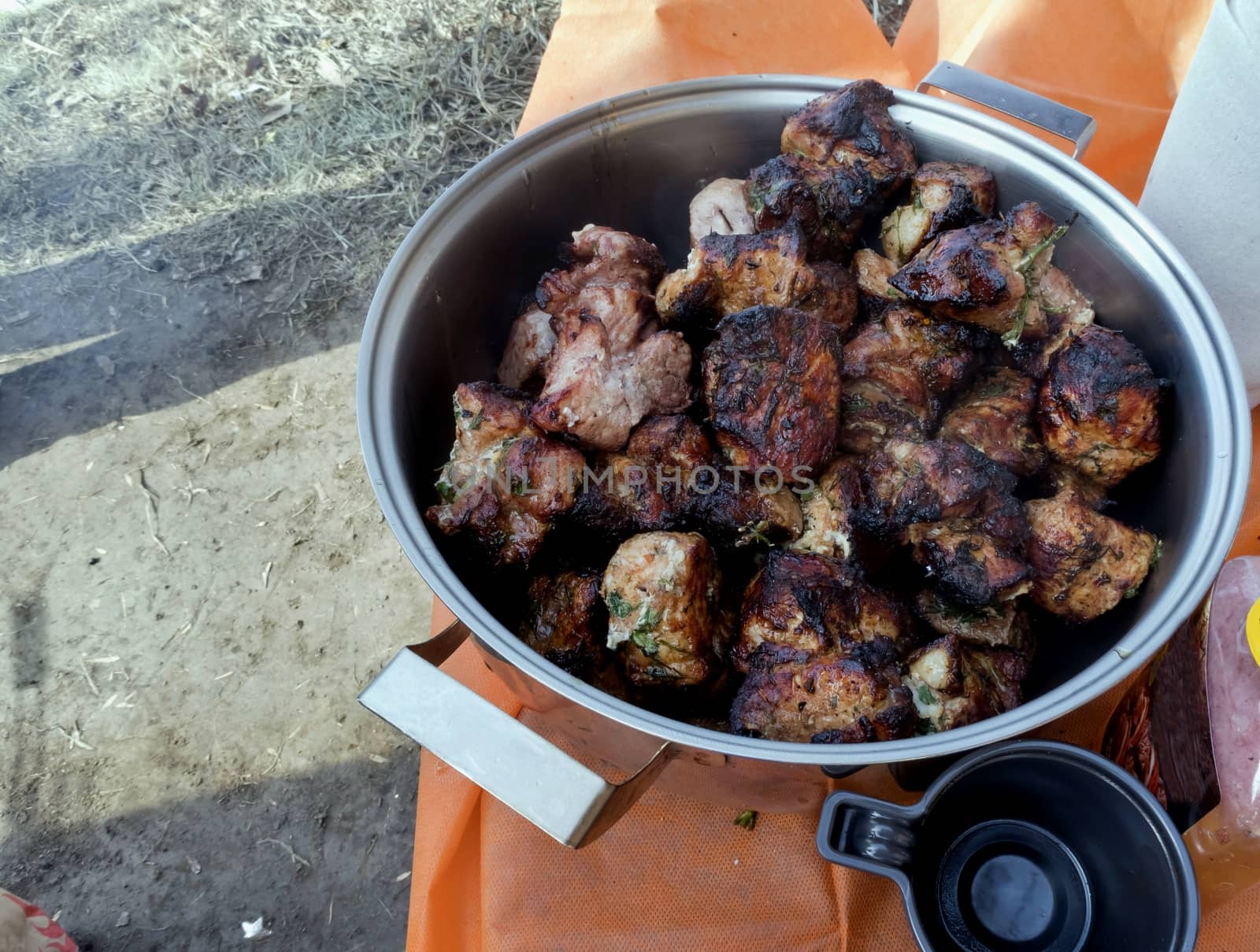 roast on the grill, the meat is collected in a large saucepan by valerypetr