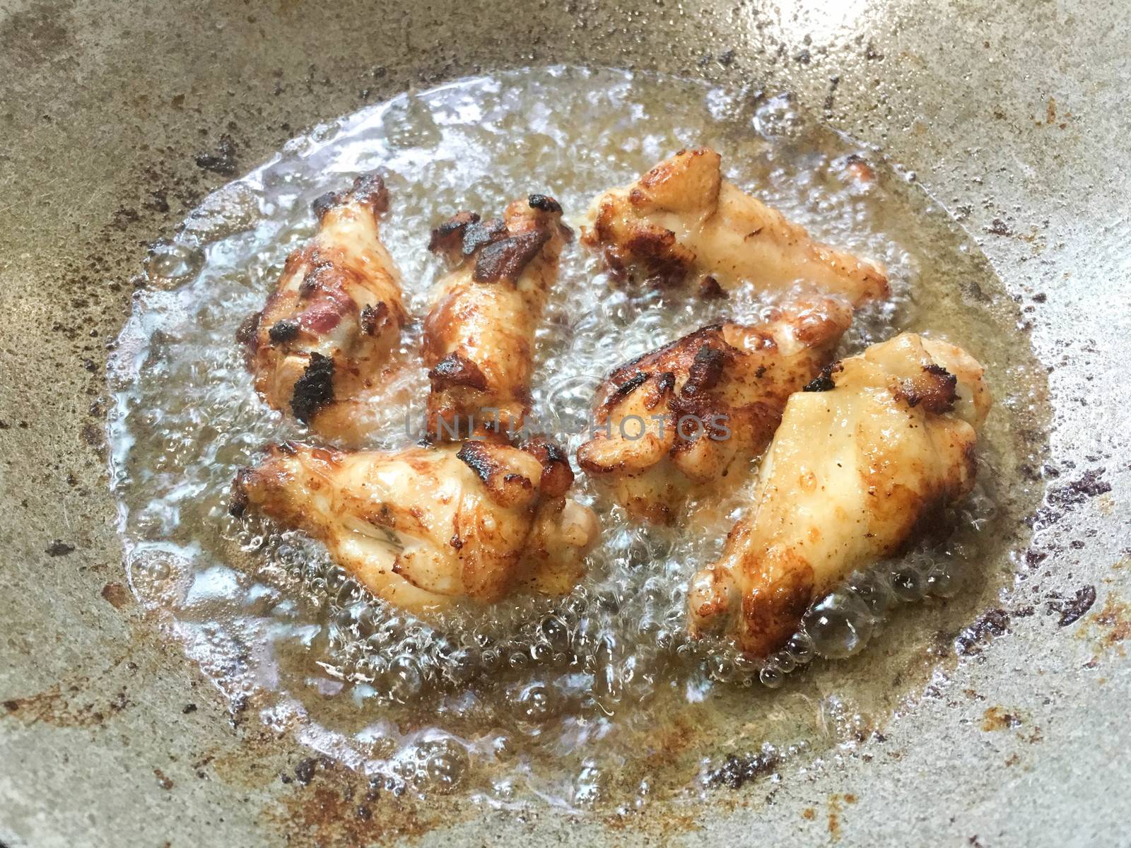 Legs of chickens in hot oil by e22xua