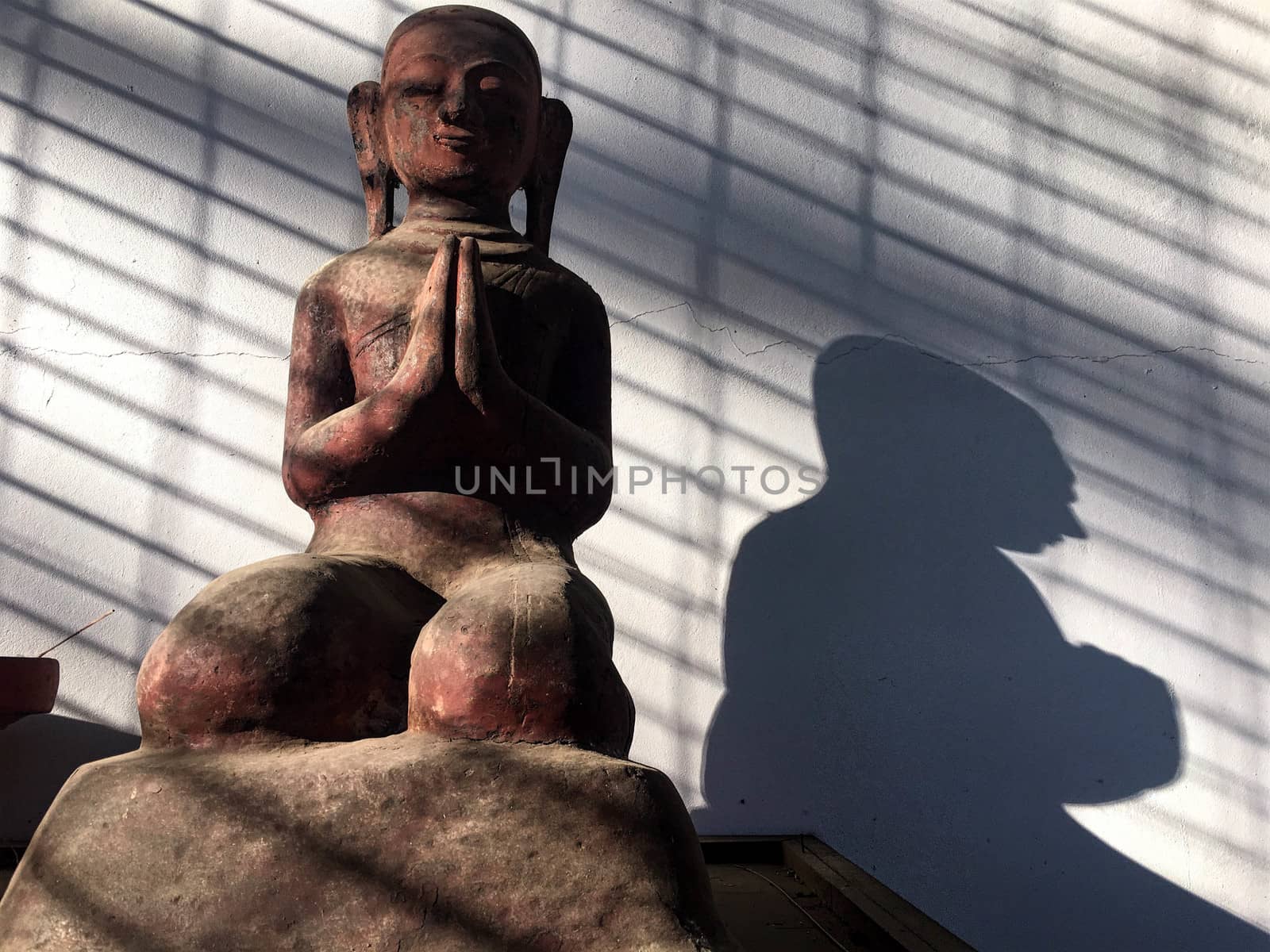 Light and shadow Buddha image. by e22xua