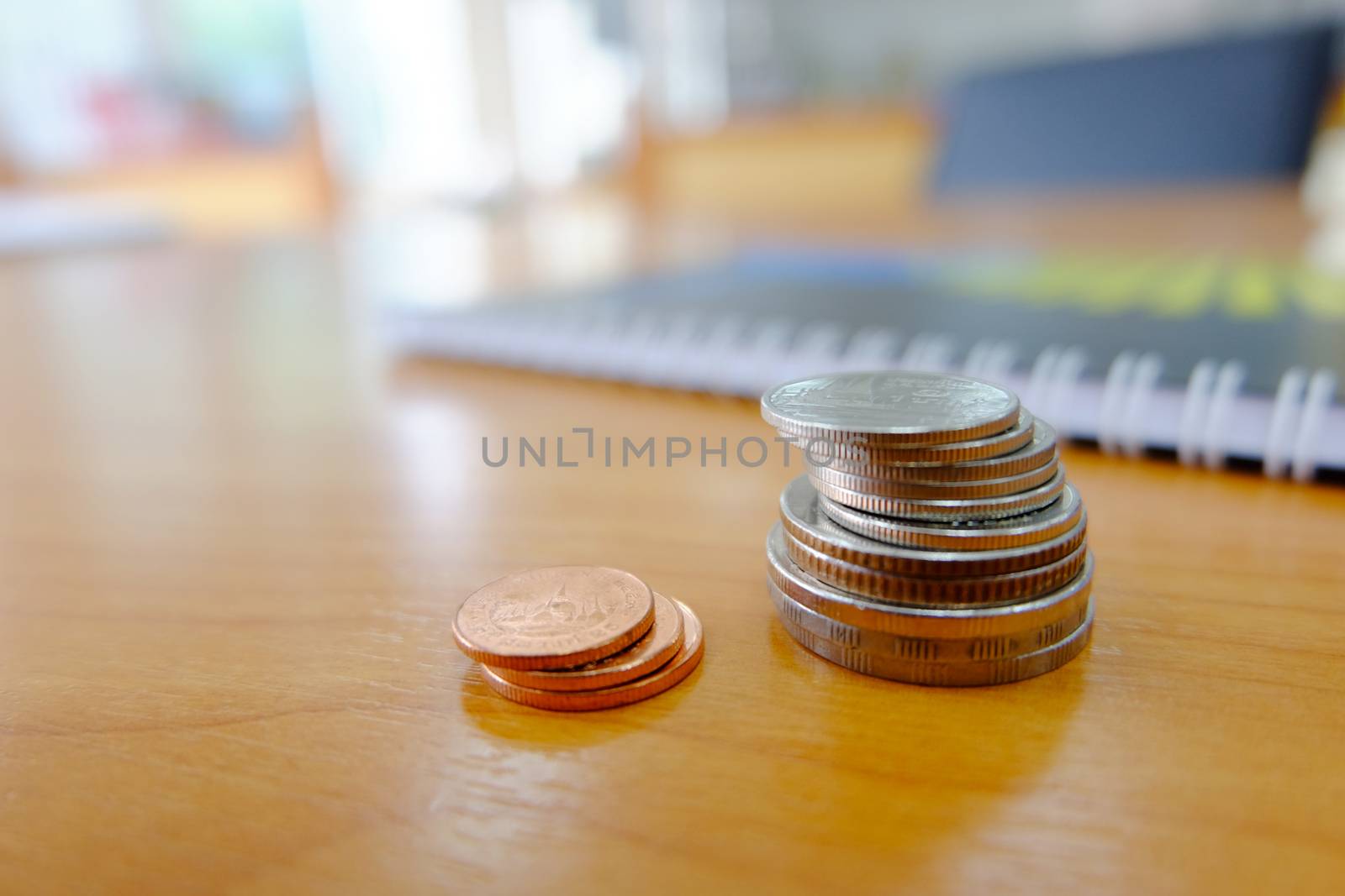Baht coins on wooden floor by e22xua