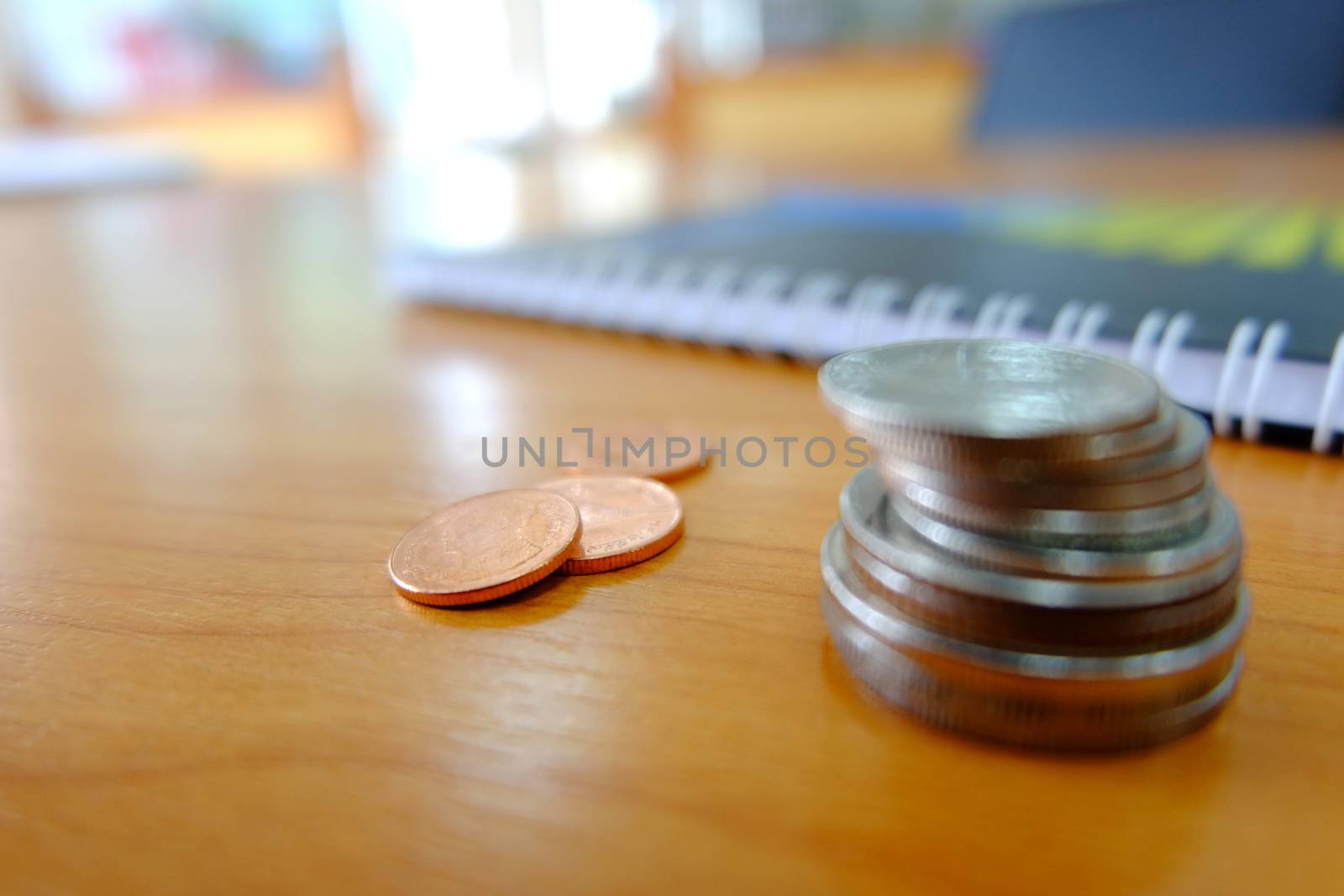 Baht coins on wooden floor by e22xua