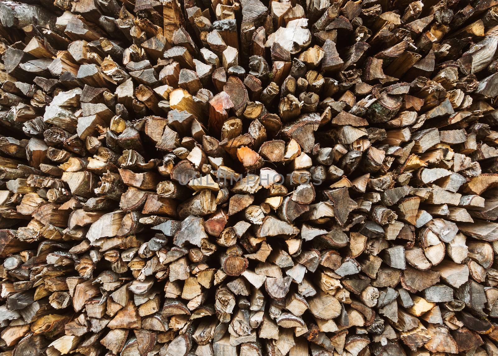 Stack of firewood, chopped firewood background.