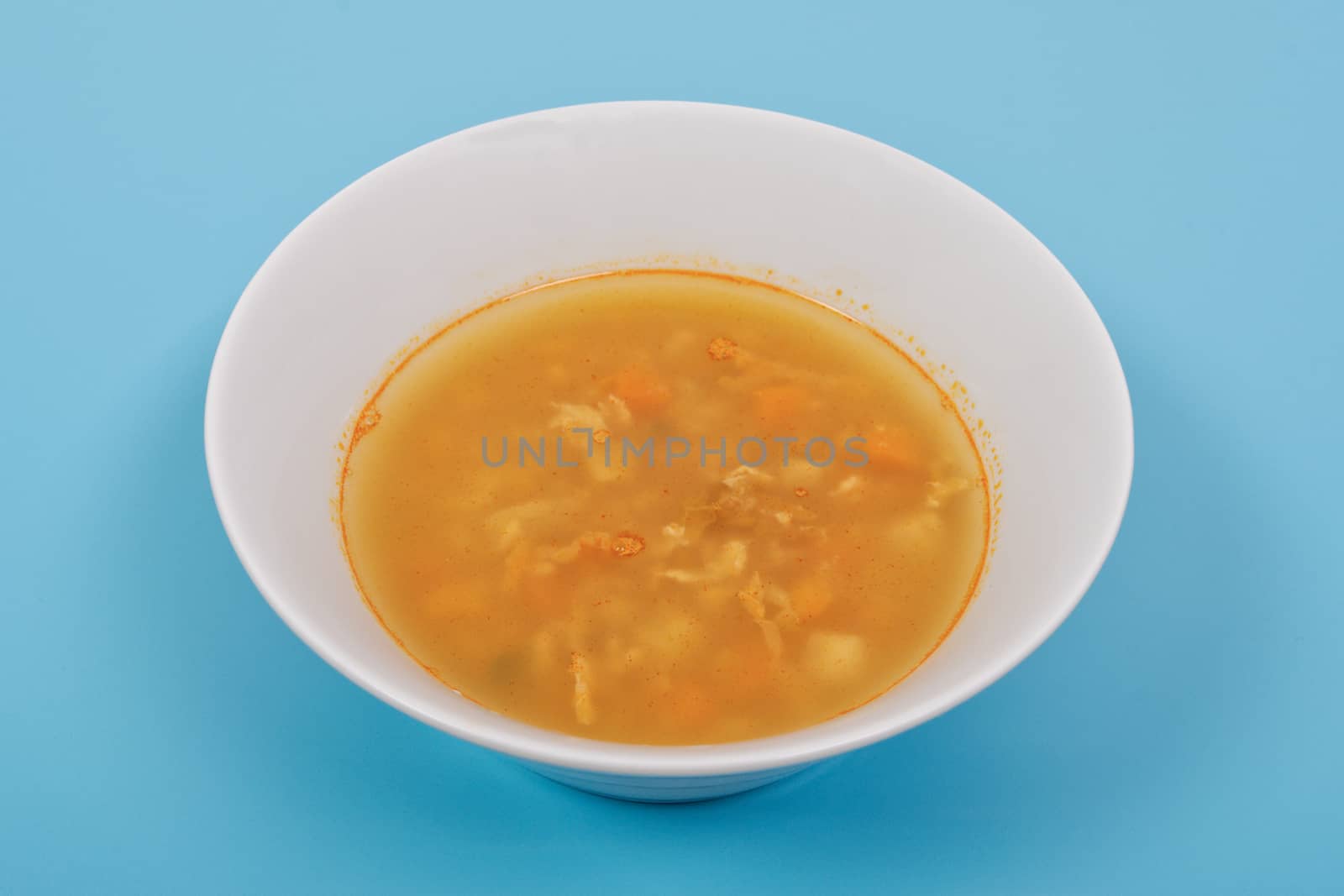 Groat soup with vegetables on a blue by neryx