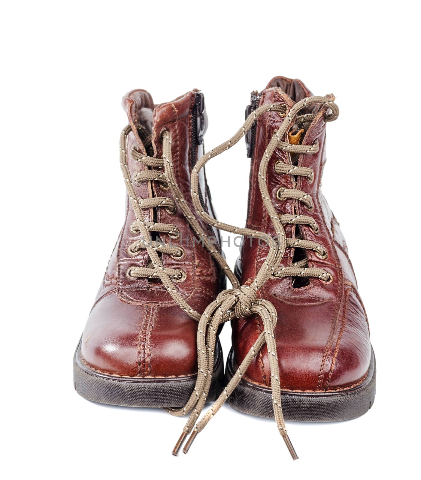 Brown leather boots with zipper and shoe-laces isolated on white