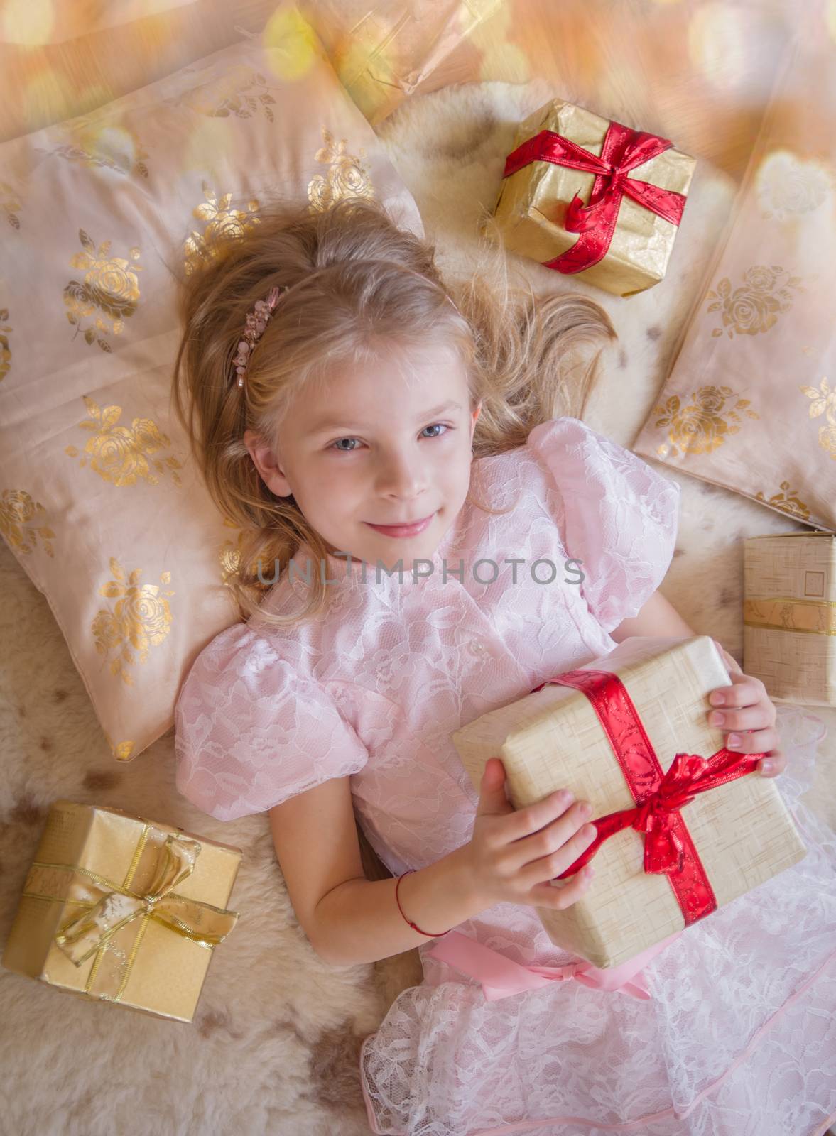 Top view of smiling kid with lots of presents by Angel_a