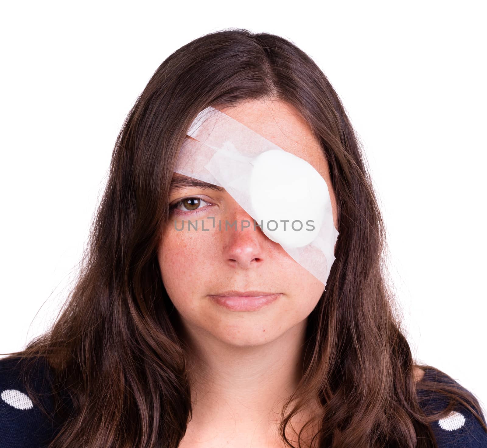 Portrait of woman wearing white eye patch as protection after injury