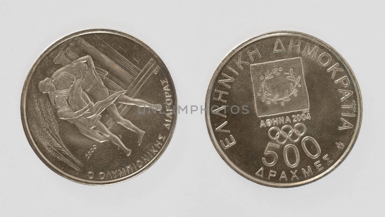 Greek coin issued for olympic games in Athens. Isolated with path on white background.