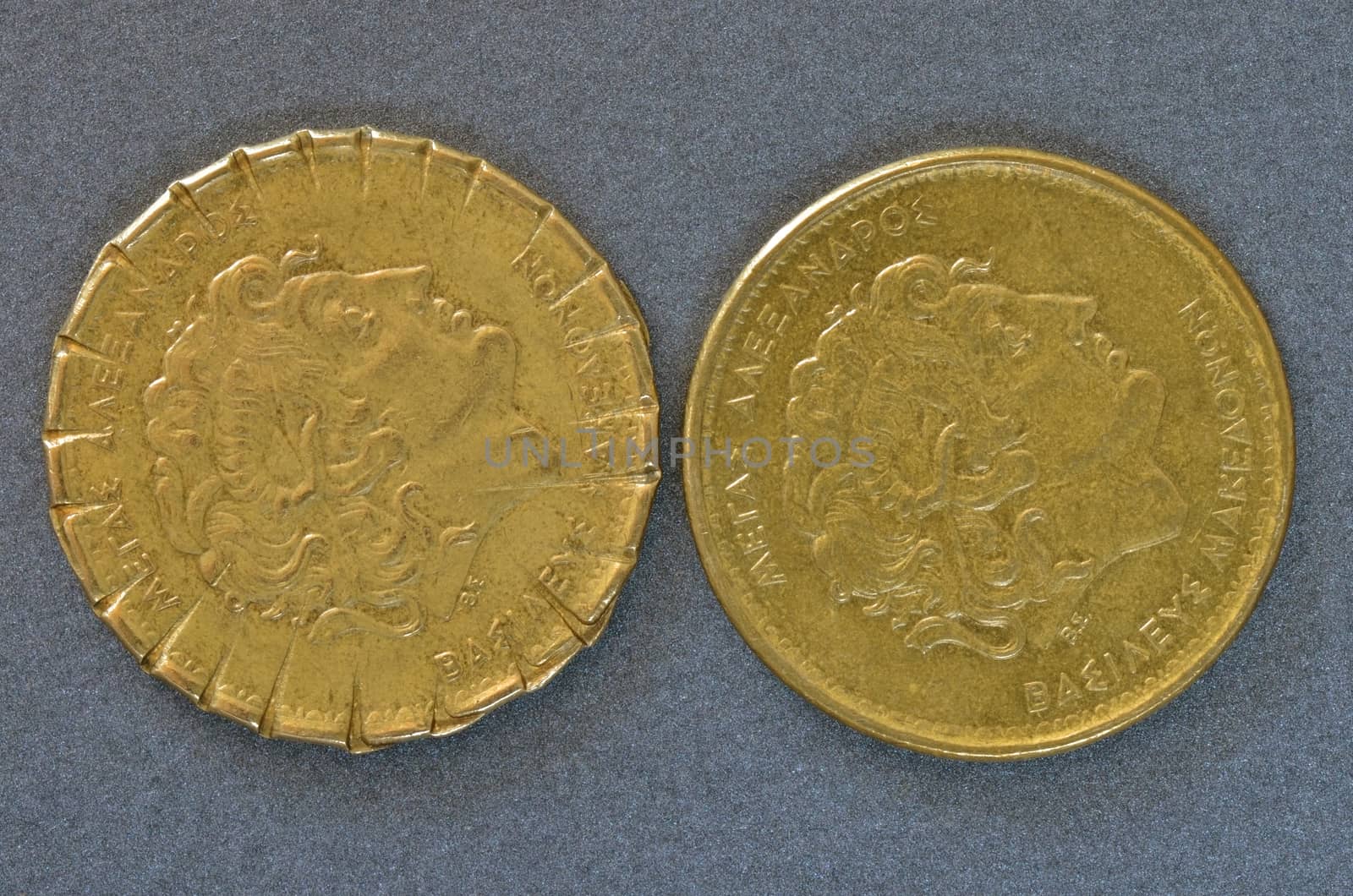 Two greek dirham coins with the same value. Old on the left side and newer redesigned on the right.