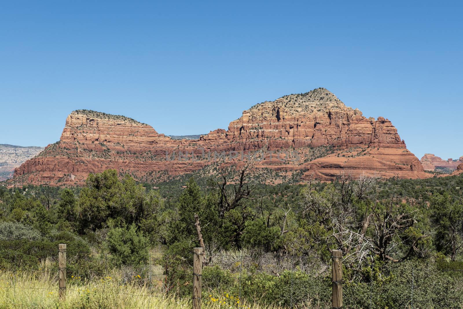 View of Twin Buttes with Chapel of the Holy Cross from Red Rock  by Njean