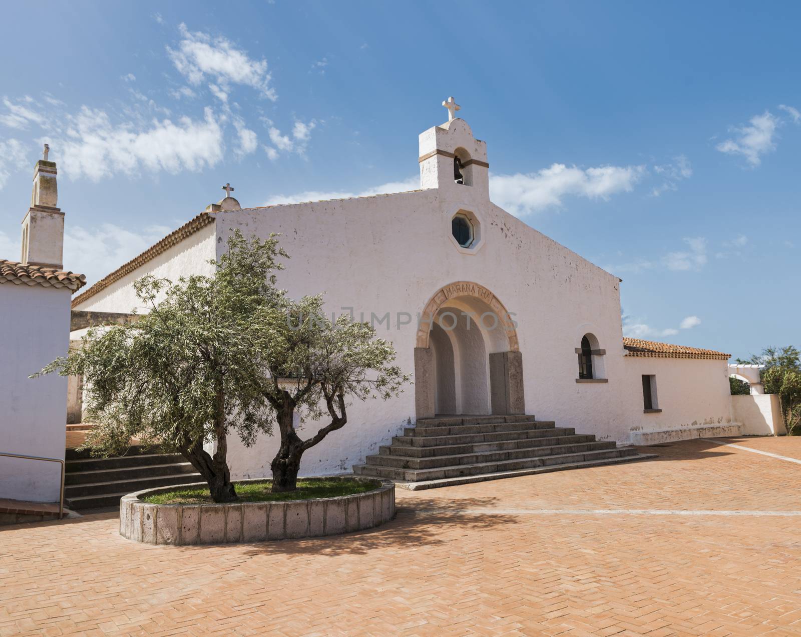 the white holy church in marinella on sardinia island with a bible made from stone