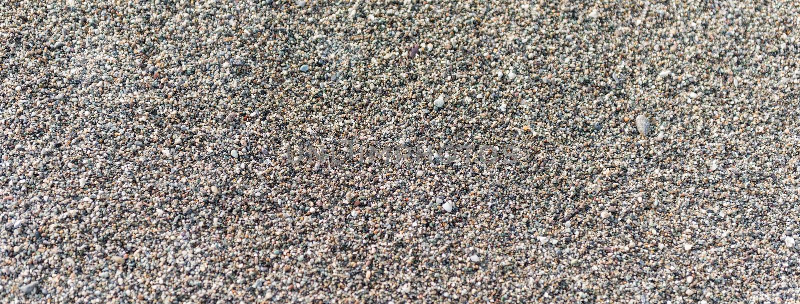 Top view of detailed sand texture on a sandy beach, may be used as background